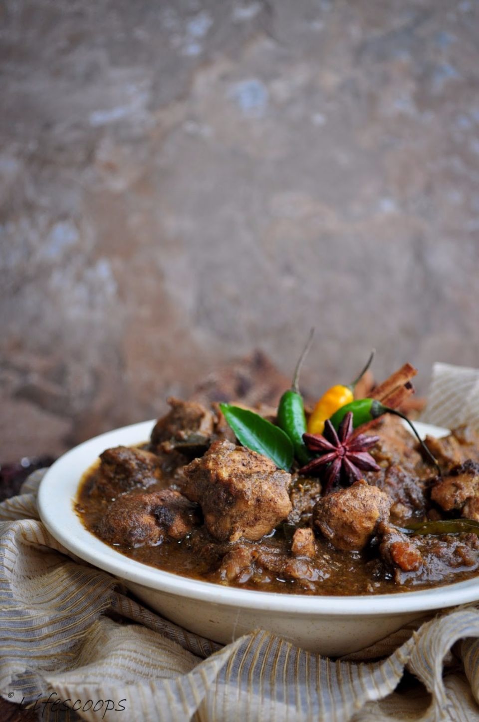 Chettinadu Chicken<br />The special dish of Tamil nadu<br />full recipe  at:<br />http://lifescoops.blogspot.in/2013/07/chettinad-chicken-curry.html<br /><br />Chettinad is a region in southern Tamil Nadu- India and among other things, is known for it's deliciously spicy and scrumptious culinary delicacies. The first time I had a Chettinad style dish was when I visited the city of Coimbatore with my family as a teen. My uncle, who was a die-hard foodie, took us to this famous restaurant known for its Chettinad style preparations and I can still remember the unique yet amazing taste of the chicken curry we had that night. Some of you might think it rather odd for me to remember such intricate details about what I ate ages ago - well I guess my brain just stores away those memorable experiences and tastes someplace, and it still remains as a muse that inspires me at times. Talking about long-term memory though,  if you ask me a basic theorem in Math or a simple equation from high-school physics that I had to learn in school,you will find me as lost as a puppy