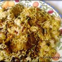 MALABAR CHICKEN BIRYANI<br /><br />Malabar Chicken Biriyani is a non vegetarian rice variety. This delicacy from the Malabar region of Kerala is very popular among Biriyani lovers.<br /><br />Ingredients<br />Basmathi rice - 1 kg<br />Chicken - 1<br />Biriyani Masala Paste<br />(green chilly, cinnamon, cloves, fennel, cardamom, peppercorn) - 4tbsp<br />Green chilly - 10<br />Ginger garlic paste - 2 tbsp<br />Coriander leaves - 50 g<br />Mint leaves - 25 g<br />Curd - 150 ml<br />Tomato - 150 g<br />Onion - 1 kg<br />Black cumin seeds - 1 tsp<br />Cinnamon stick - 2 pieces<br />Bay leaves - 2<br />Cashew nuts kismis - 50 g<br />Cardamom - 5<br />Ghee - 200 g<br />Coriander powder - 2 tbsp<br />Milk - 500 ml<br />Saffron - 1 pinch<br />Water (For rice) - 1 litre<br /><br />Method of preparation<br />Heat the ghee in a saucepan; saute the onions till golden brown colour and add sliced tomatoes saute well. Put ginger garlic paste, curd and biriyani masala and turmeric powder, and coriander powder. Add the chicken pieces and cook well. Soak the rice about 10 minutes and drain well. Melt the ghee in a saucepan and add in the spices and sliced onion mint, coriander leaves, cashew nuts, kismis, bay leaves and saute till brown in colour. Add milk and water. Allow to boil and then add rice. Lower the heat, cover and continue to cook for 15 minutes. Take another saucepan and place half the rice into it. And add the chicken on the top of the rice. And put the remaining rice on top of the chicken. And spread to make an even layer. Make random holes through the rice with a spoon and pour into each a little saffron milk. Place a few knobs of ghee, fried onion, cashew nuts and kismis on the surface and cover tightly.