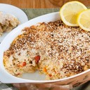 Salmon Casserole<br /><br />This creamy, cheese-filled casserole makes a great springtime meal for the whole family.<br />INGREDIENTS<br /><br />Select ingredients:<br />3 tablespoons butter<br />1 cup onion, diced<br />½ cup red bell pepper, chopped<br />½ cup yellow bell pepper, chopped<br />2 tablespoons flour<br />½ teaspoon black pepper<br />2½ cups milk<br />4 ounces Gouda cheese, grated<br />4 ounces Monterey Jack cheese, grated<br />The juice of half a lemon<br />1 teaspoon lemon zest<br />8 ounces of your favorite pasta, cooked and drained<br />One 10-ounce package of salmon (skin and bones removed)<br />1 cup plain panko breadcrumbs<br />2 tablespoons parsley<br />SAVE CHECKED INGREDIENTS TO SHOPPING LIST<br />DIRECTIONS<br /><br />Melt the butter in a large skillet and sauté the onions and peppers for approximately 5 minutes.<br />Add in the flour and ¼ teaspoon of the black pepper, stir until well combined.<br />Add the milk and continue stirring constantly over medium heat until it thickens slightly.<br />Stir in the parsley and grated cheeses until melted.<br />Add the lemon juice and lemon zest and stir.<br />Remove the skillet from the heat.<br />Place the cooked pasta, the cheese sauce, and the salmon in a large bowl and combine. Transfer to a 2½- to 3-quart baking dish and top with the breadcrumbs, the remaining black pepper, and the remaining parsley.<br />Bake in a 350-degree oven for 30 to 40 minutes or until thoroughly heated.