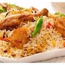 MALABAR CHICKEN BIRYANI<br /><br />Malabar Chicken Biriyani is a non vegetarian rice variety. This delicacy from the Malabar region of Kerala is very popular among Biriyani lovers.<br /><br />Ingredients<br />Basmathi rice - 1 kg<br />Chicken - 1<br />Biriyani Masala Paste<br />(green chilly, cinnamon, cloves, fennel, cardamom, peppercorn) - 4tbsp<br />Green chilly - 10<br />Ginger garlic paste - 2 tbsp<br />Coriander leaves - 50 g<br />Mint leaves - 25 g<br />Curd - 150 ml<br />Tomato - 150 g<br />Onion - 1 kg<br />Black cumin seeds - 1 tsp<br />Cinnamon stick - 2 pieces<br />Bay leaves - 2<br />Cashew nuts kismis - 50 g<br />Cardamom - 5<br />Ghee - 200 g<br />Coriander powder - 2 tbsp<br />Milk - 500 ml<br />Saffron - 1 pinch<br />Water (For rice) - 1 litre<br /><br />Method of preparation<br />Heat the ghee in a saucepan; saute the onions till golden brown colour and add sliced tomatoes saute well. Put ginger garlic paste, curd and biriyani masala and turmeric powder, and coriander powder. Add the chicken pieces and cook well. Soak the rice about 10 minutes and drain well. Melt the ghee in a saucepan and add in the spices and sliced onion mint, coriander leaves, cashew nuts, kismis, bay leaves and saute till brown in colour. Add milk and water. Allow to boil and then add rice. Lower the heat, cover and continue to cook for 15 minutes. Take another saucepan and place half the rice into it. And add the chicken on the top of the rice. And put the remaining rice on top of the chicken. And spread to make an even layer. Make random holes through the rice with a spoon and pour into each a little saffron milk. Place a few knobs of ghee, fried onion, cashew nuts and kismis on the surface and cover tightly.