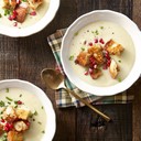 Cauliflower Bisque with Brown Butter Croutons<br /><br />Ingredients<br /><br />2 c. whole milk<br />2½ c. vegetable stock<br />1 small head cauliflower (about 1 pound total), separated into florets<br />3/4 lb. Yukon gold potatoes, peeled and chopped<br />1 small onion, chopped<br />2 cloves Garlic, crushed<br />4 sprigs thyme<br />Kosher salt and freshly ground black pepper<br />3 tbsp. unsalted butter<br />3 c. cubed ciabatta bread<br />1/3 c. heavy cream<br />1/3 c. pomegranate seeds<br />Chopped chives, for serving<br />Directions<br /><br />Combine milk, stock, cauliflower, potato, onion, garlic, and thyme in a large saucepan. Season with salt and pepper. Bring to a boil over medium-high heat; reduce heat and simmer, partially covered, until the vegetables are very tender, 18 to 20 minutes.<br />Meanwhile, melt butter in a large skillet over medium heat. Cook, swirling occasionally, until golden brown, 2 to 4 minutes. Add bread and cook, stirring often, until toasted, 10 to 12 minutes. Season with salt and pepper.<br />Discard thyme sprigs. Puree soup, in batches, in a blender until smooth. Add cream and pulse to combine. Season with salt and pepper.<br />Serve topped with croutons, pomegranate seeds, and chives.