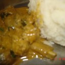 NATU KODI KURA~COUNTRY CHICKEN CURRY<br /><br />Country chicken cooked in a very spicy way is an all time favorite of rayalaseema non-vegetarian  people.<br />though this is not  as spicy as usually made, it tastes the same.I have been to my mom's place recently and she cooked this for me!!. hope you all like it.<br /><br />Ingredients:<br /> 1kg country chicken cut into small pieces<br /> 2 large onion sliced<br /> 1/2 tsp turmeric powder<br /> Salt to taste<br /> 2-3 tsp chilli powder<br /> 2 tsp corriander powder<br /> 10-12 curry leaves<br /> 2 cardamom pods(elaichi)<br /> 3cinnamon sticks(dalchinichakka)<br /> 7-8 pepper corns<br /> 5-6 tsp of oil<br /> 100 gms fresh coconut<br /> 10 gms poppy seeds(gasalu)<br /> 20 gms ginger<br /> 1 small garlic<br /> corriander for garnish<br /><br />Process:<br />1.wash the chicken pieces and keep aside.<br /> 2.Grind coconut,poppy seeds,ginger,garlic and one onion into a smooth paste.<br /> 3.Now take a pan and heat oil and add chopped onions to it.<br />4.When the onions are fried add the chicken pieces to it.<br />5. Now add turmeric powder and salt to it.<br /> 6.After frying for 5 minutes add the grinded paste to it.<br />7.Stir it well. and fry for another five minutes.<br />8.Add chilli powder to it.<br />9.After mixing well add corriander powder to it.<br />10. It takes more amount of water and time for the country chicken to cook than the ordinary ones.<br /> so pour about 3 glasses of water to it.<br />11.Add the curry leaves to it.<br />12. Now close the lid and cook for about16-17 minutes.<br /> 13.Now add the grinded spices(elaichi,cardamom,cinnamon,pepper corns and poppy seeds).<br />14. Lastly add corriander and serve hot with rice or sangati or chapathi.