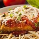 CHICKEN PARMESAN<br /><br />INGREDIENTS<br /><br />2 cups fine dry breadcrumbs<br />1 cup all-purpose flour<br />4 large eggs<br />1 cup whole milk<br />8 small skinless, boneless chicken thighs, pounded to 1/2" thickness<br />Kosher salt, freshly ground pepper<br />N/A freshly ground pepper<br />8 tablespoons olive oil<br />8 tablespoons prepared sun-dried tomato pesto<br />1 pound fresh mozzarella, cut into 8 slices<br />1/2 teaspoon crushed red pepper flakes<br />4 cups prepared marinara sauce, warmed<br />Finely grated Parmesan (for serving)<br />PREPARATION<br /><br />Place breadcrumbs and flour in 2 separate shallow bowls. Whisk eggs and milk in a medium bowl. Season chicken with salt and pepper. Dredge in flour, shaking off excess. Coat with beaten egg mixture, allowing excess to drip back into bowl. Coat with breadcrumbs, pressing to adhere. Place on a large plate or rimmed baking sheet.<br />Heat 2 tablespoons oil in a large skillet over medium heat. Working in 4 batches, cook thighs until chicken is golden brown and cooked through, about 4 minutes per side; transfer to a paper towel-lined plate. Wipe skillet clean and add 2 tablespoons oil between batches.<br />Preheat broiler. Lay 4 cutlets on a foil-lined baking sheet; spread each with 2 tablespoons pesto, top with a slice of cheese, and sprinkle with red pepper. Top with remaining cutlets and cheese. Broil until cheese browns, about 4 minutes.<br />Divide sauce and chicken among shallow bowls and top with Parmesan.
