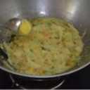 Ravva Kichidi:<br />How to make Rava Khichdi/Kichadi<br /><br />Prep time - under 15 mins<br />Cook time - under 20 mins<br />Serves - 2<br /><br />Ingredients needed <br /><br />Rava/Sooji/Semolina -1 cup <br />Onion - 3/4 cup finely chopped<br />Ginger - 1 tsp finely chopped <br />Green chillies -2 slit<br />Vegetables - 3/4 cup ( mix of beans, carrot, peas and 1/2 a tomato)<br />Turmeric powder - 1/4 tsp<br />Water - 3 cups<br />For topping up - 1 tsp ghee<br />For roasting - 1 tsp ghee<br /><br />For the seasoning <br /><br />Oil - 2 tbsp + Ghee - 1 tbsp<br />Mustard seeds - 1 tsp <br />Bengal gram/ kadalai paruppu- 2 tsp <br />Urad dal -1 tsp <br />Curry leaves - few <br /><br />Rava Khichdi preparation<br /><br />Roast rava in a tsp of ghee until you get a nice aroma of roasted rava. Skip this step if you have bought roasted rava.<br /><br />Chop all the vegetables finely. Slit green chillies and keep it ready.<br /><br />Method<br /><br />Heat ghee+oil in a pan/kadai, add bengal gram, when it changes colour slightly, add mustard seeds, urad dal and curry leaves.<br /><br />When urad dal turns golden brown, add finely chopped onions, slit chillies and ginger.<br /><br />Saute until onions turn transparent. Then add all the finely chopped vegetables and turmeric powder. Look how colorful it is.(picture below)<br /><br />Saute and cook the vegetables for 2-3 minutes. Do not over cook the vegetables as it will get cooked along with the rava.<br /><br />Now add 3 cups of hot water and salt needed. You can taste the water and check for salt. If it is slightly salty, it will be perfect after adding rava.